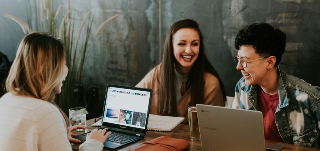 college students laughing at a table